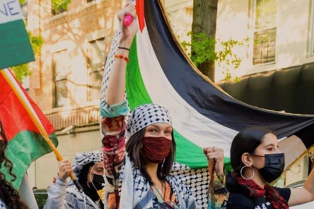 a group of people holding flags