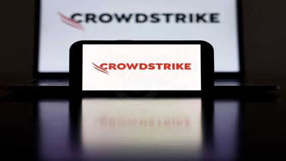 LOS ANGELES, CALIFORNIA- JULY 19: In this photo illustration, the CrowdStrike logo is displayed on a cell phone and computer monitor on July 19, 2024 in Los Angeles, California. Businesses and airlines worldwide continue to be affected by a global technology outage attributed to a software update administered by CrowdStrike, a cybersecurity firm whose software is used by various industries around the world. (Photo Illustration by Mario Tama/Getty Images) (Photo by MARIO TAMA / GETTY IMAGES NORTH AMERICA / Getty Images via AFP)